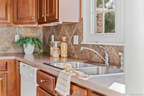 a kitchen with a sink and a window
