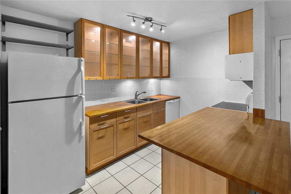 1015 Southwest 9th Street, Unit D2 Gainesville, FL 32601 - Photo 1 of 1 a kitchen with a sink appliances and cabinets
