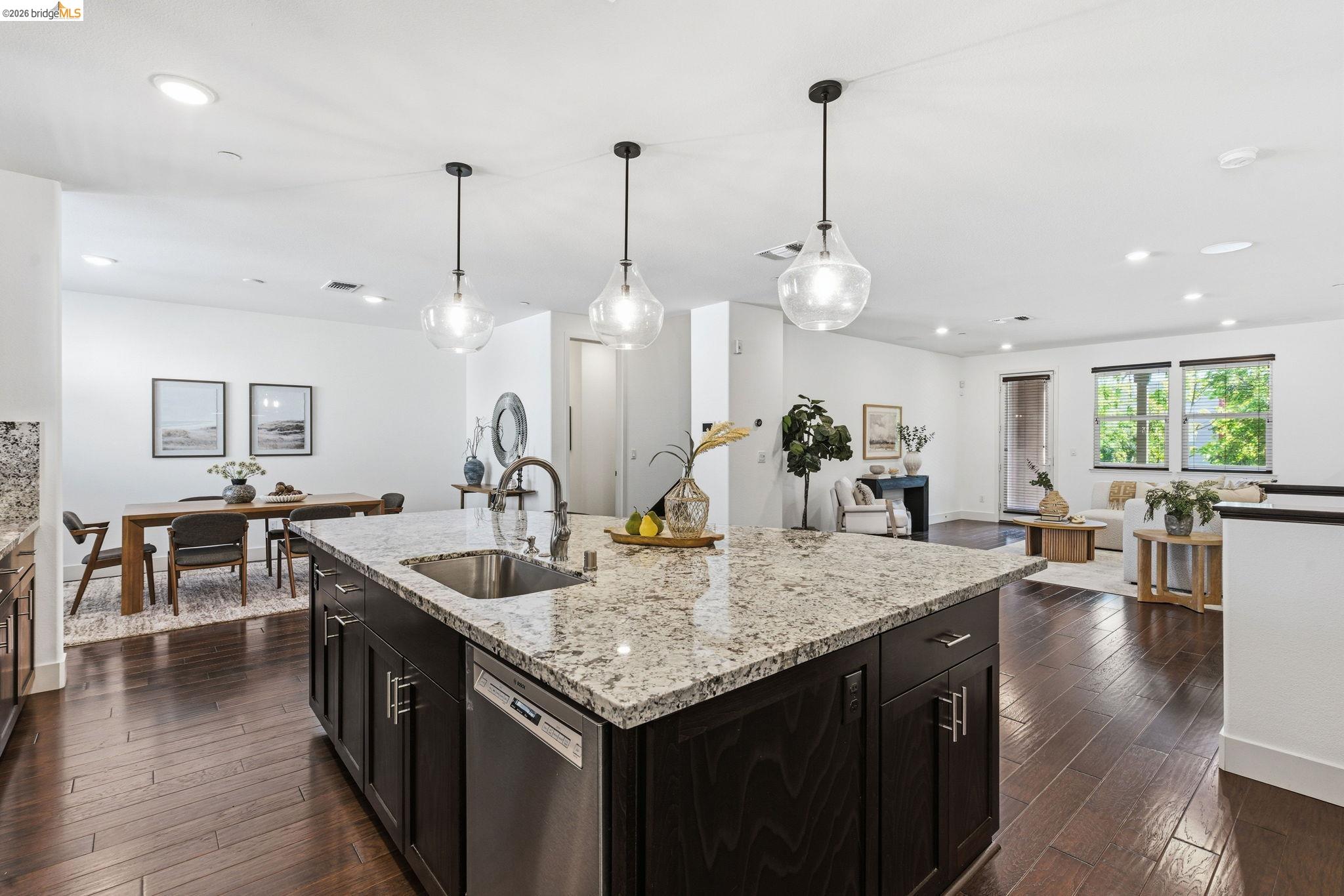 475 Mitchell Avenue Alameda, CA 94501 - Photo 36 of 40 a kitchen with stainless steel appliances granite countertop a kitchen island a stove a table and chairs