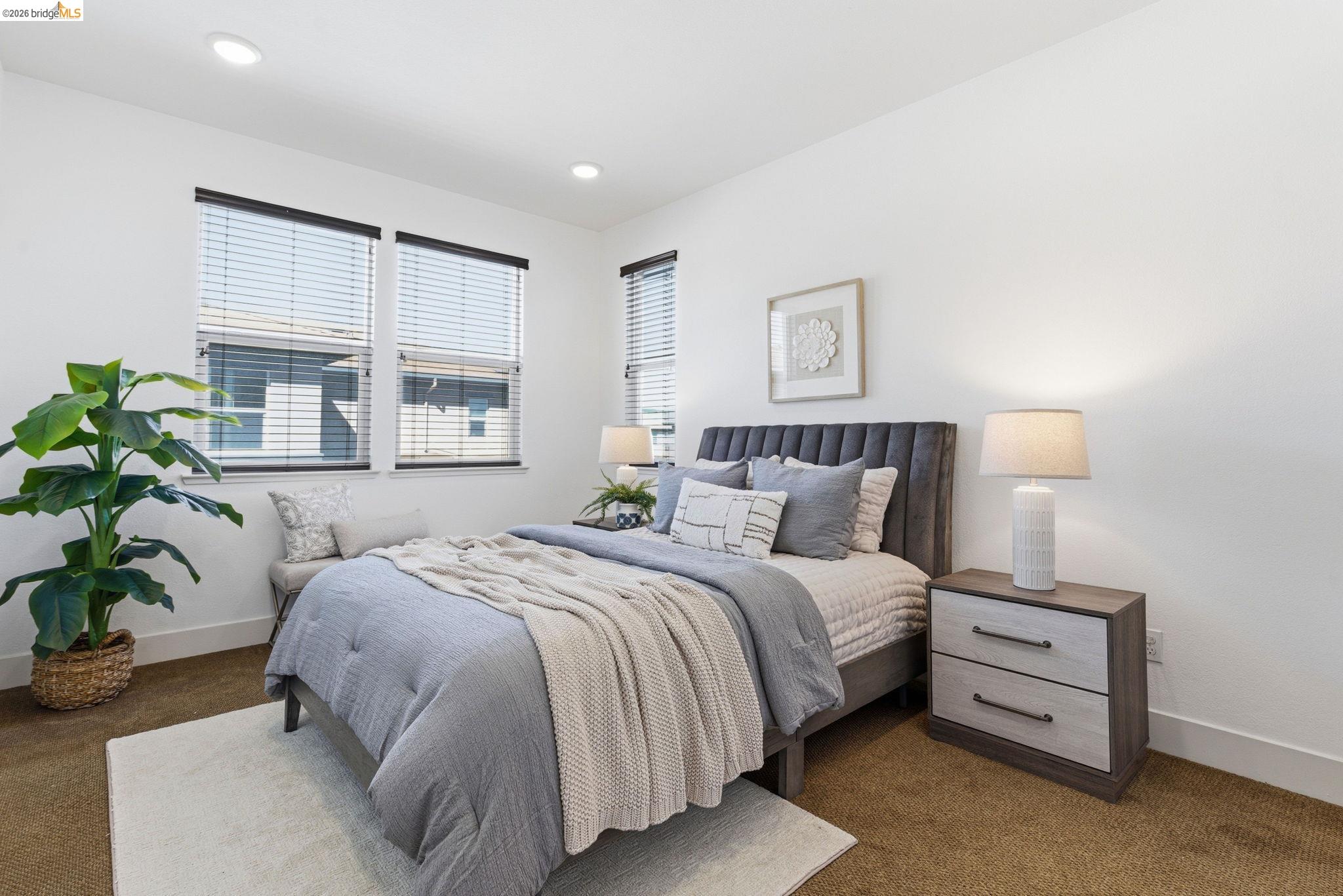 475 Mitchell Avenue Alameda, CA 94501 - Photo 18 of 40 a bedroom with a bed and a potted plant