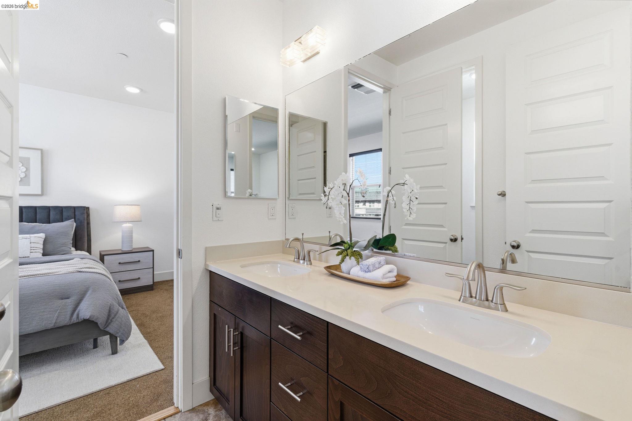 475 Mitchell Avenue Alameda, CA 94501 - Photo 20 of 40 a en suite bathroom with double sink and a mirror