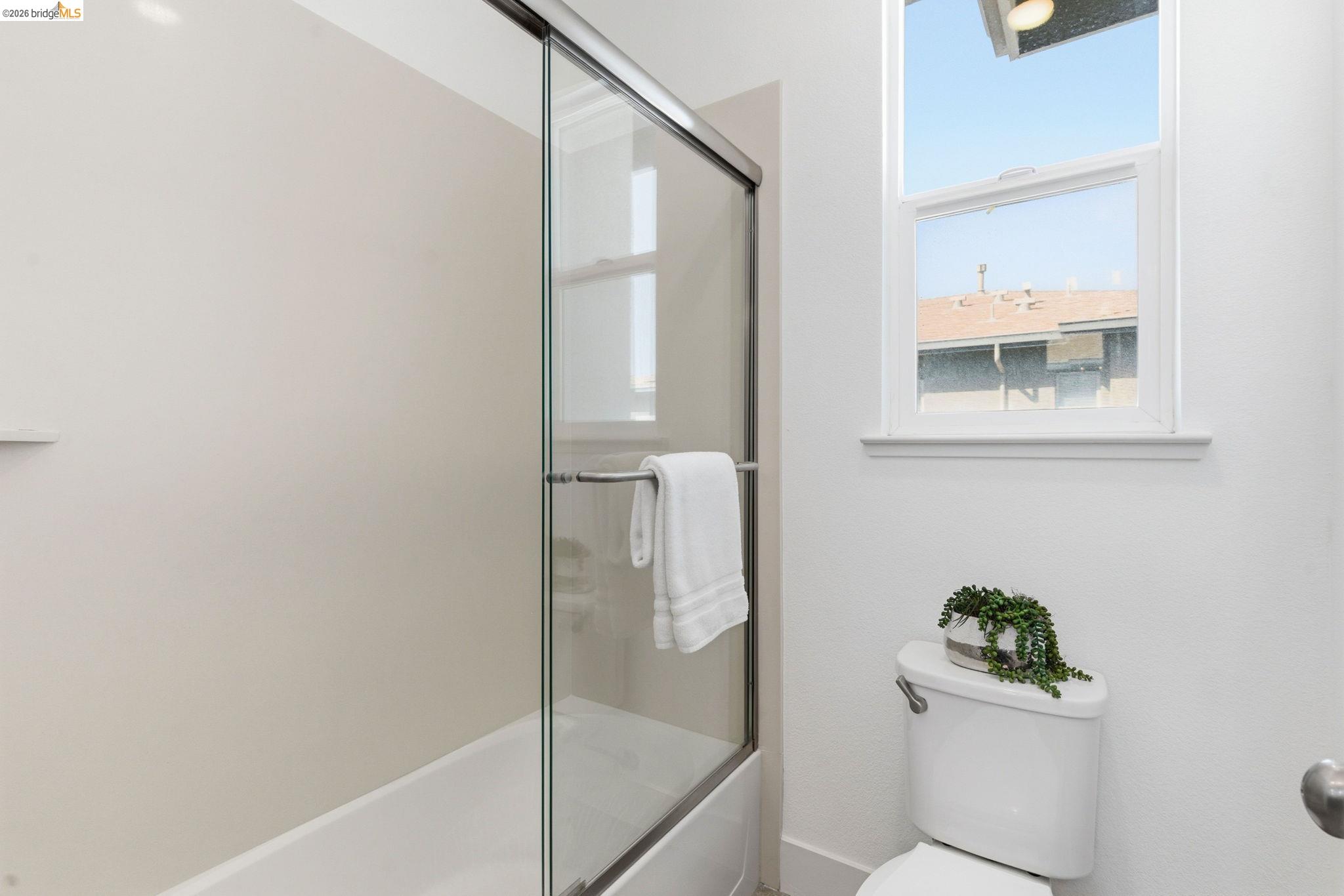 475 Mitchell Avenue Alameda, CA 94501 - Photo 21 of 40 a bathroom with a bathtub and shower