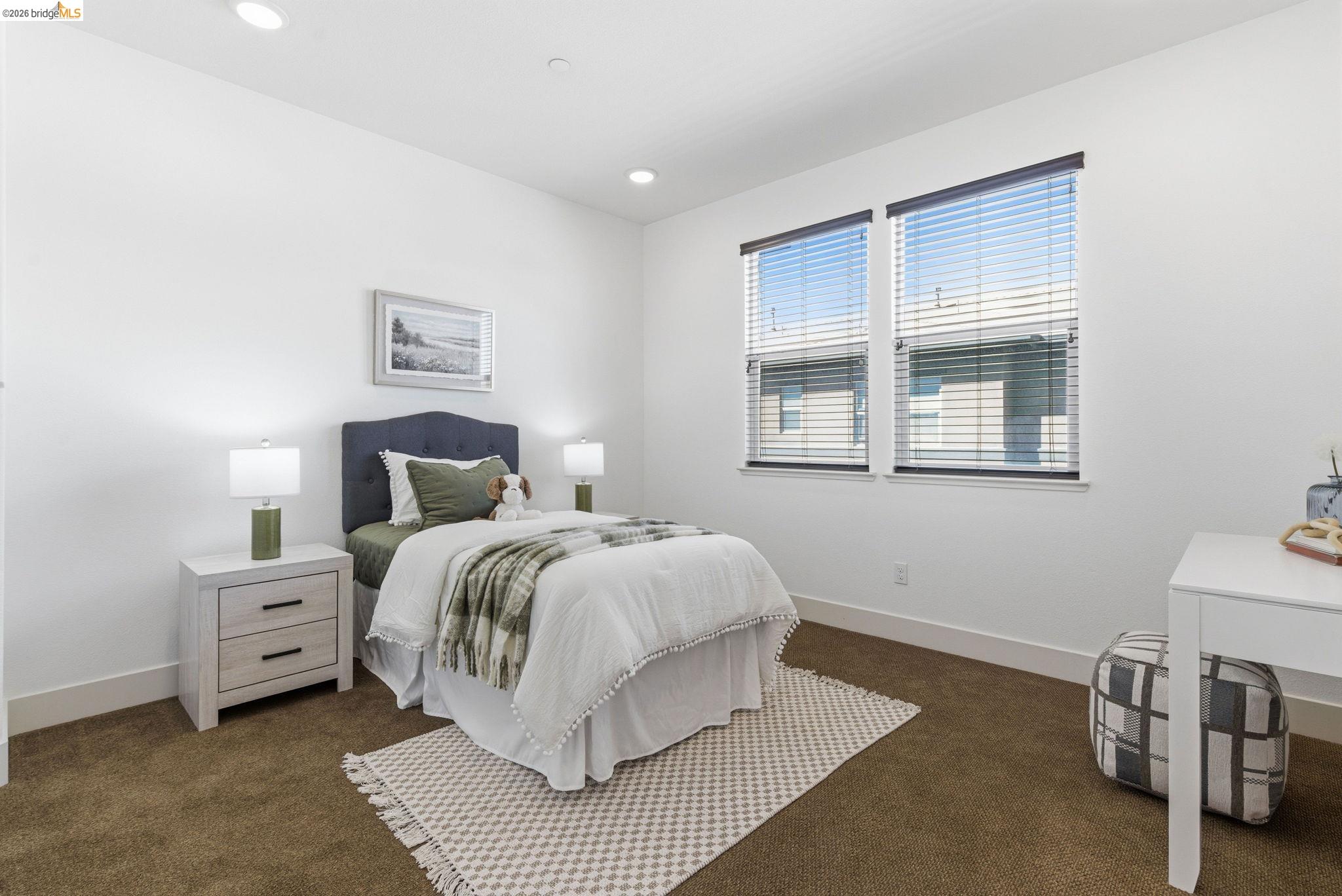 475 Mitchell Avenue Alameda, CA 94501 - Photo 22 of 40 a spacious bedroom with a bed and a window