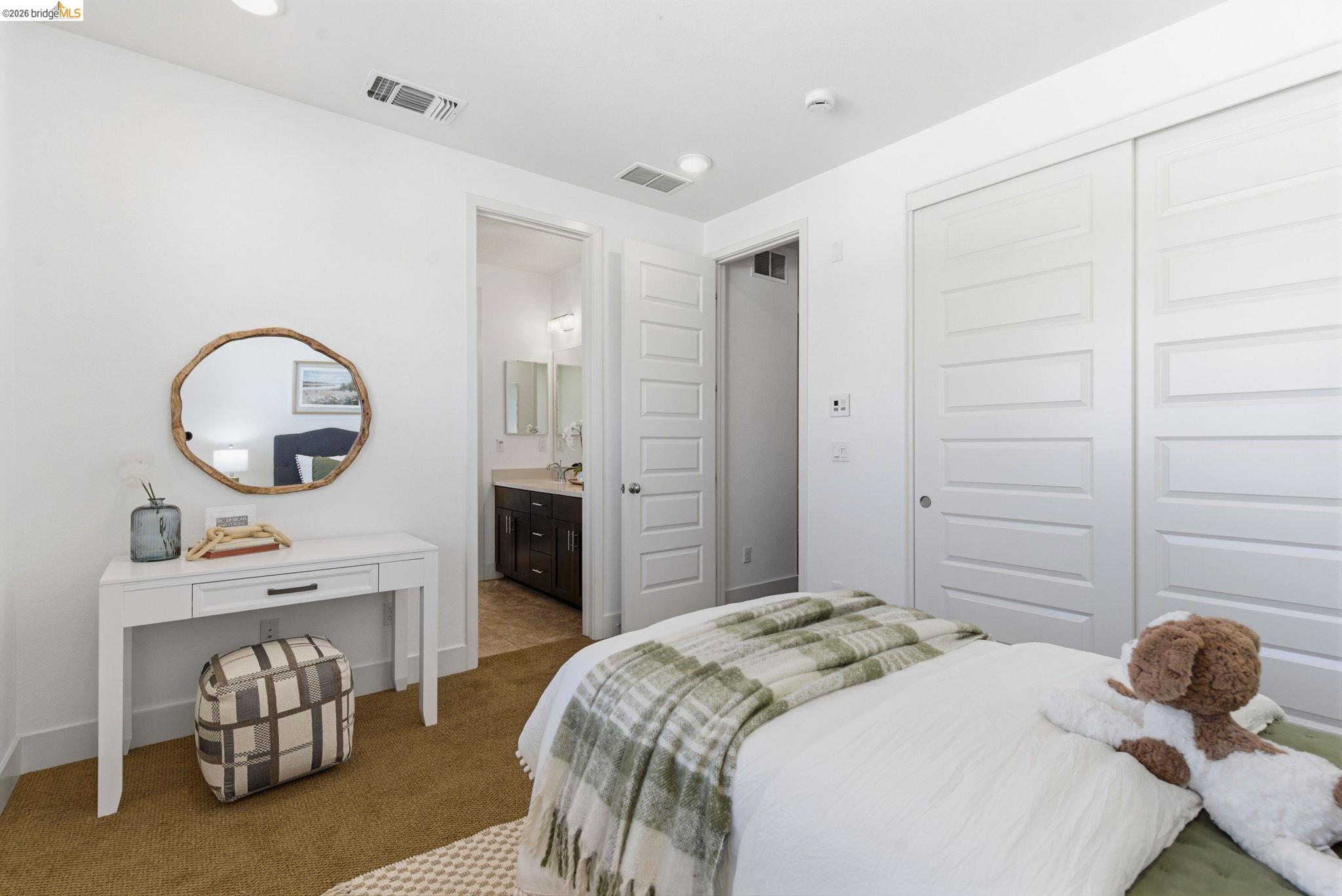475 Mitchell Avenue Alameda, CA 94501 - Photo 23 of 40 a bedroom with a bed a mirror and a dresser