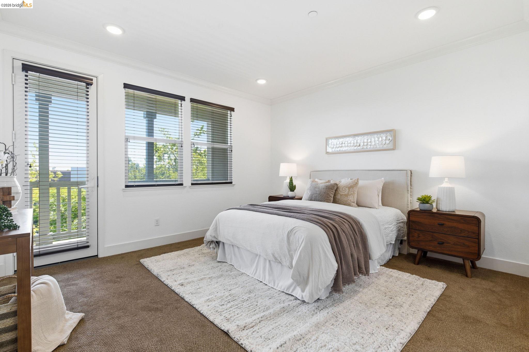 475 Mitchell Avenue Alameda, CA 94501 - Photo 24 of 40 a spacious bedroom with a bed and a couch