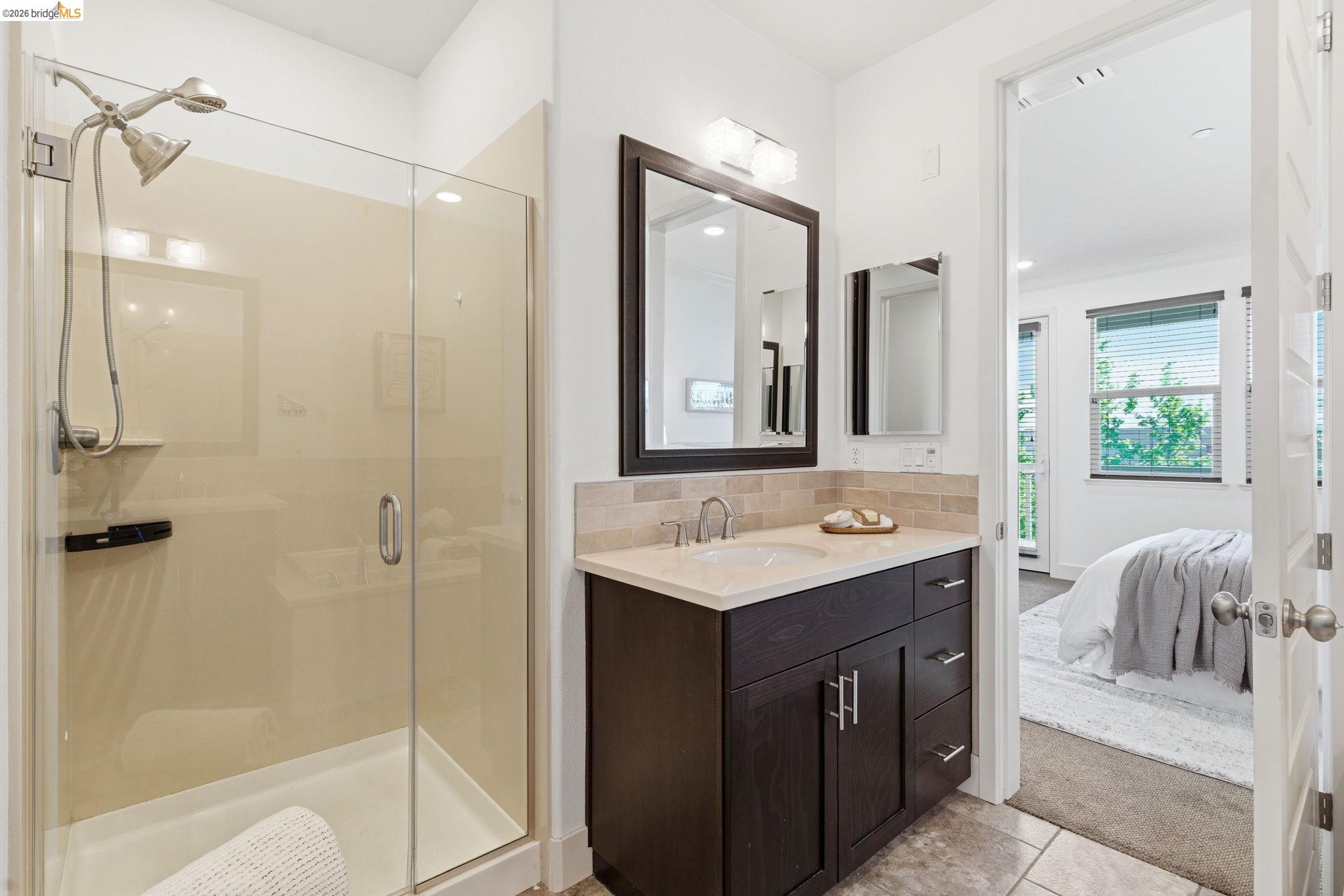 475 Mitchell Avenue Alameda, CA 94501 - Photo 29 of 40 a bathroom with a sink vanity tub and shower