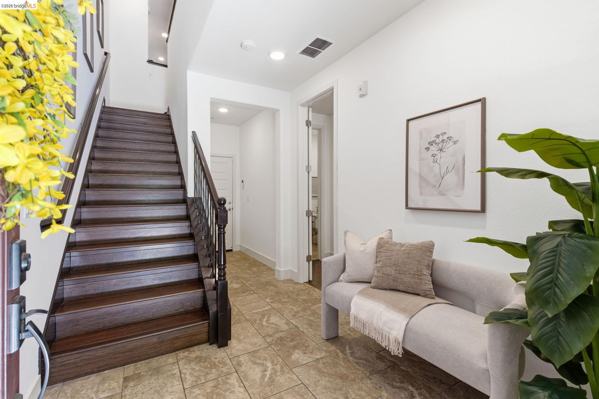 475 Mitchell Avenue Alameda, CA 94501 - Photo 3 of 40 a living room with furniture and stairs