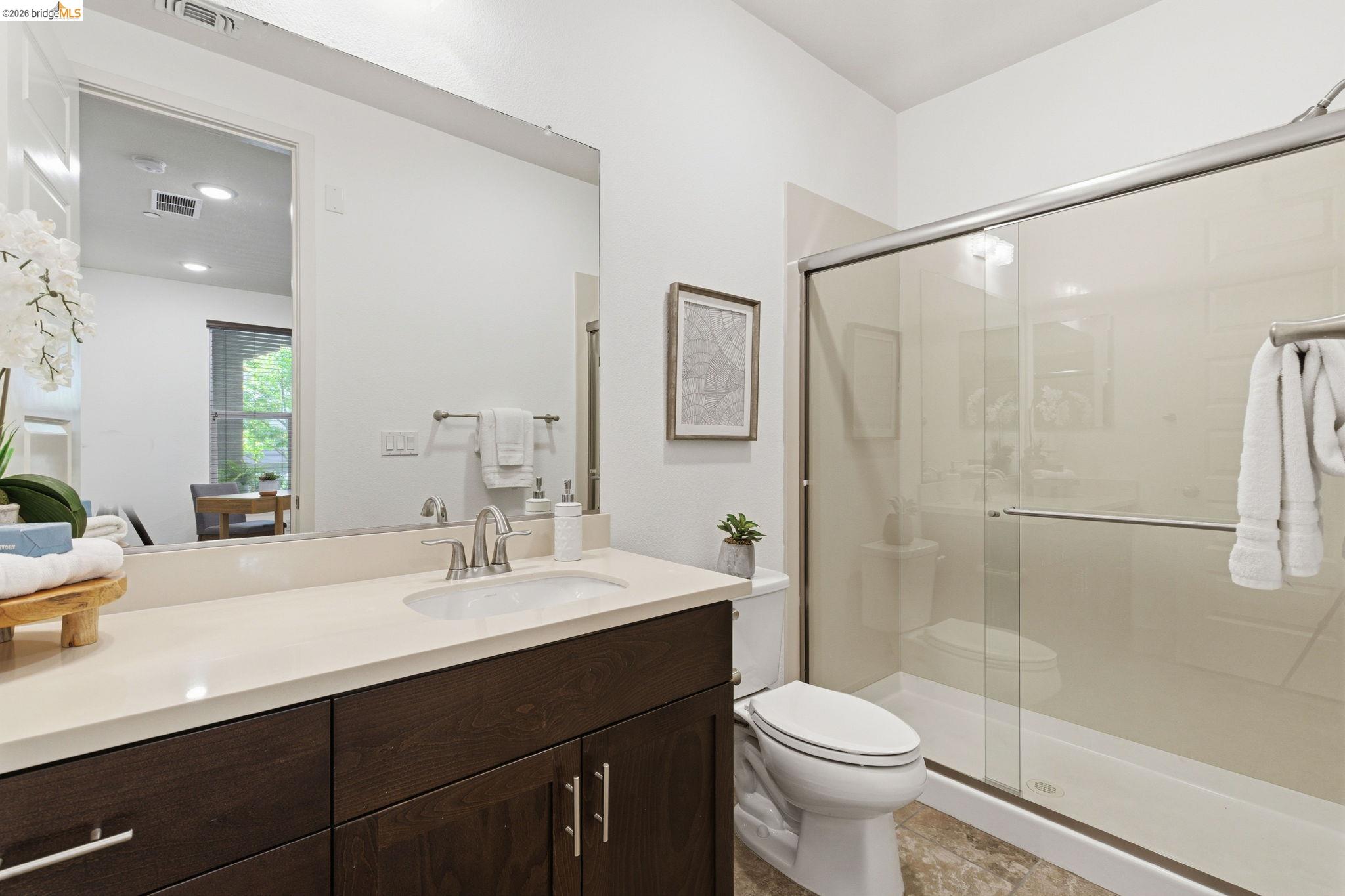 475 Mitchell Avenue Alameda, CA 94501 - Photo 7 of 40 a bathroom with a sink a toilet and shower