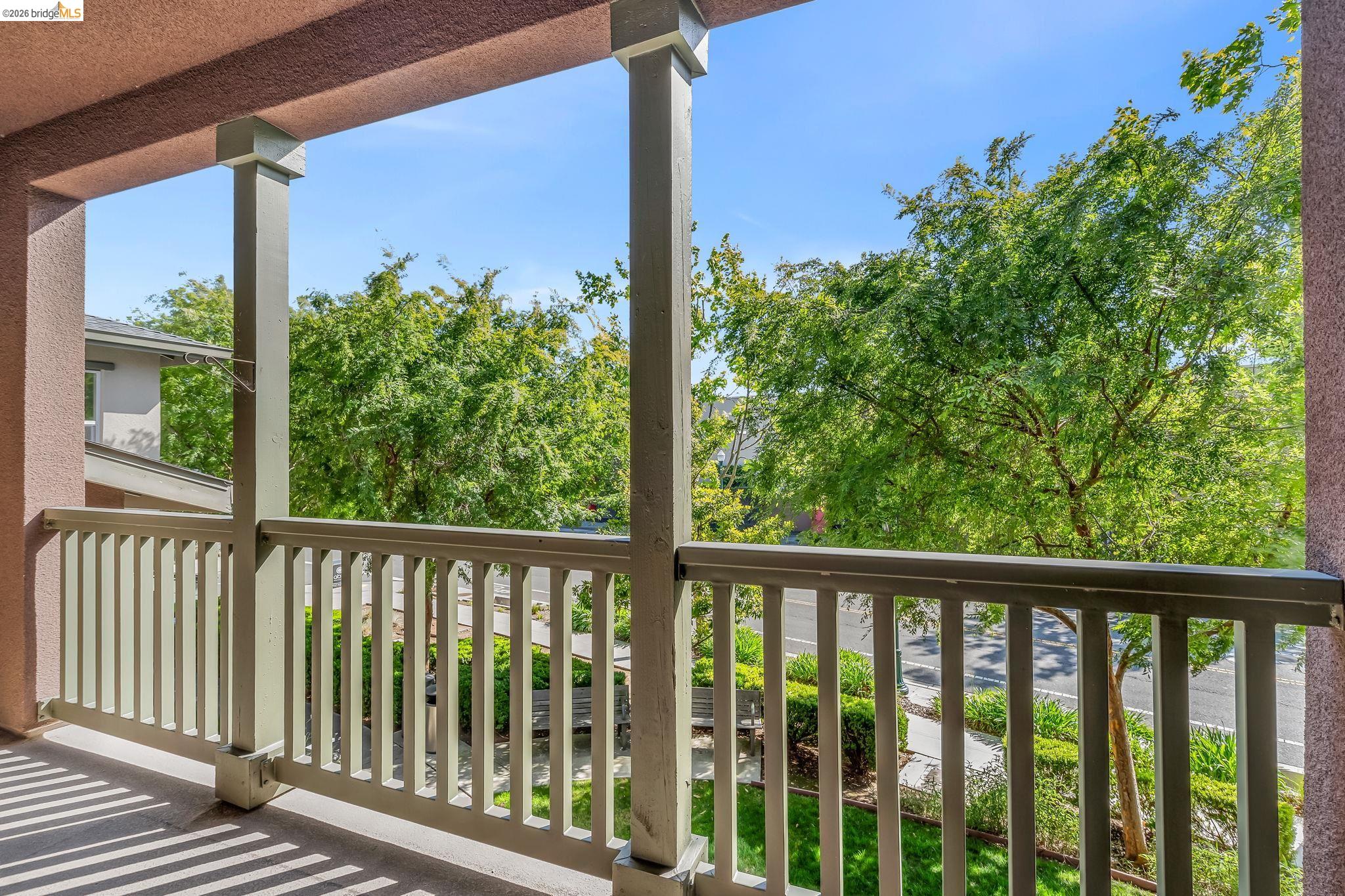 475 Mitchell Avenue Alameda, CA 94501 - Photo 9 of 40 a view of a porch with a floor to ceiling window and wooden fence