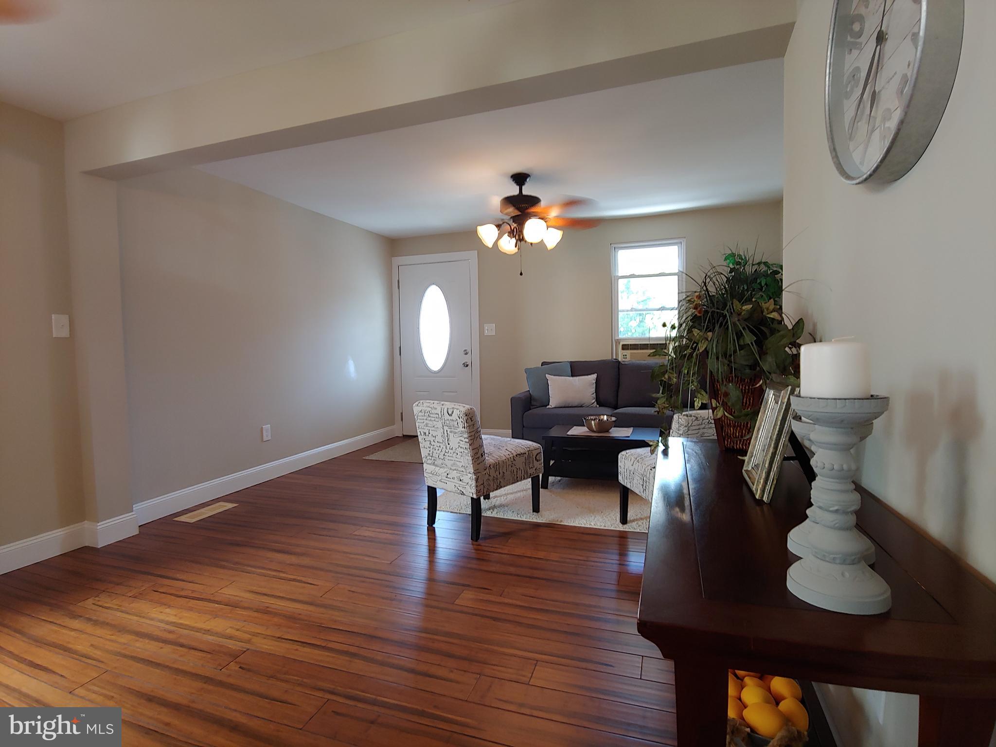 150 Rancocas Road Mount Holly, NJ 08060 - Photo 16 of 25 a living room with furniture potted plant and a lamp