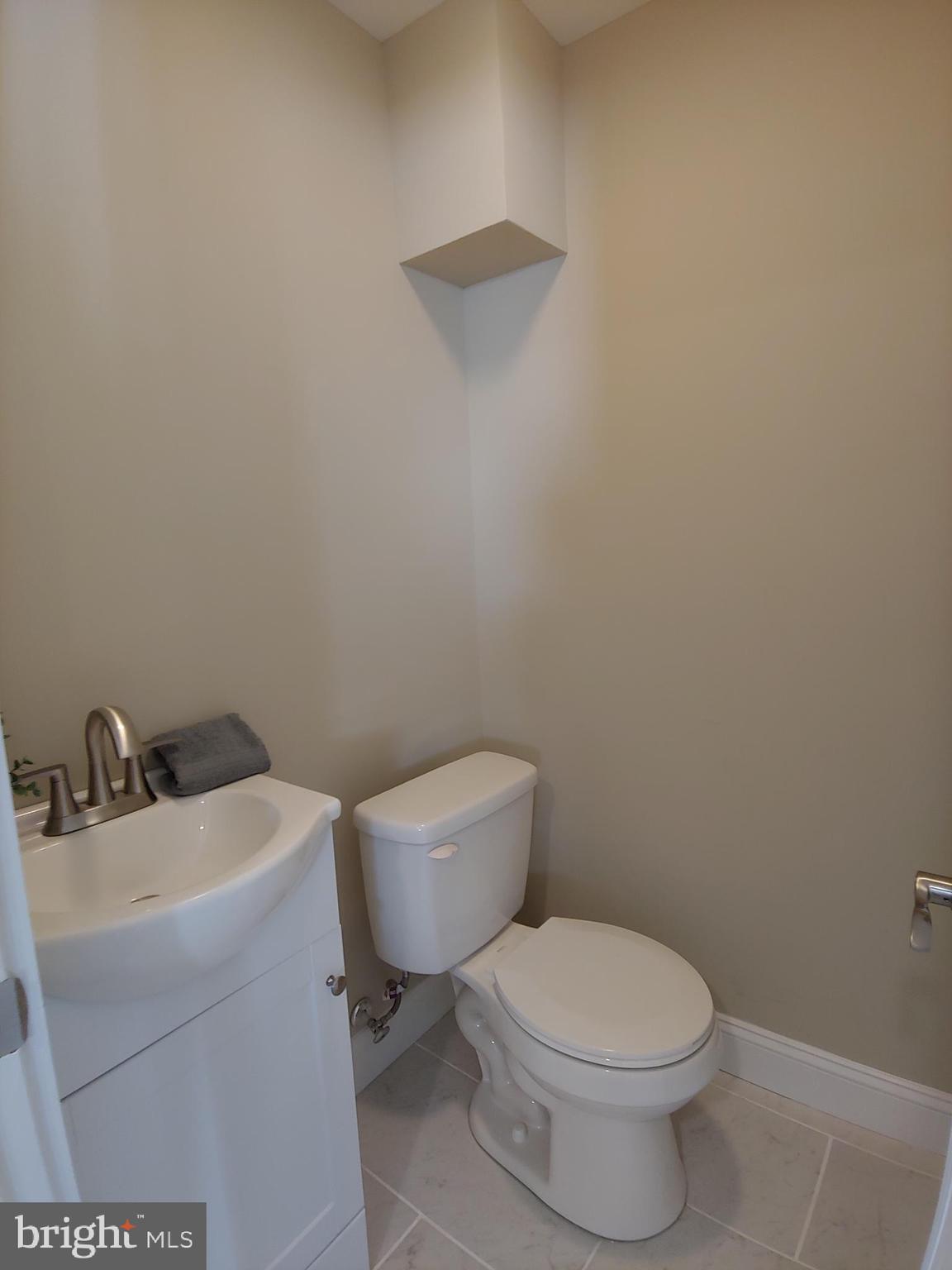 150 Rancocas Road Mount Holly, NJ 08060 - Photo 17 of 25 a white toilet sitting next to a bathroom sink
