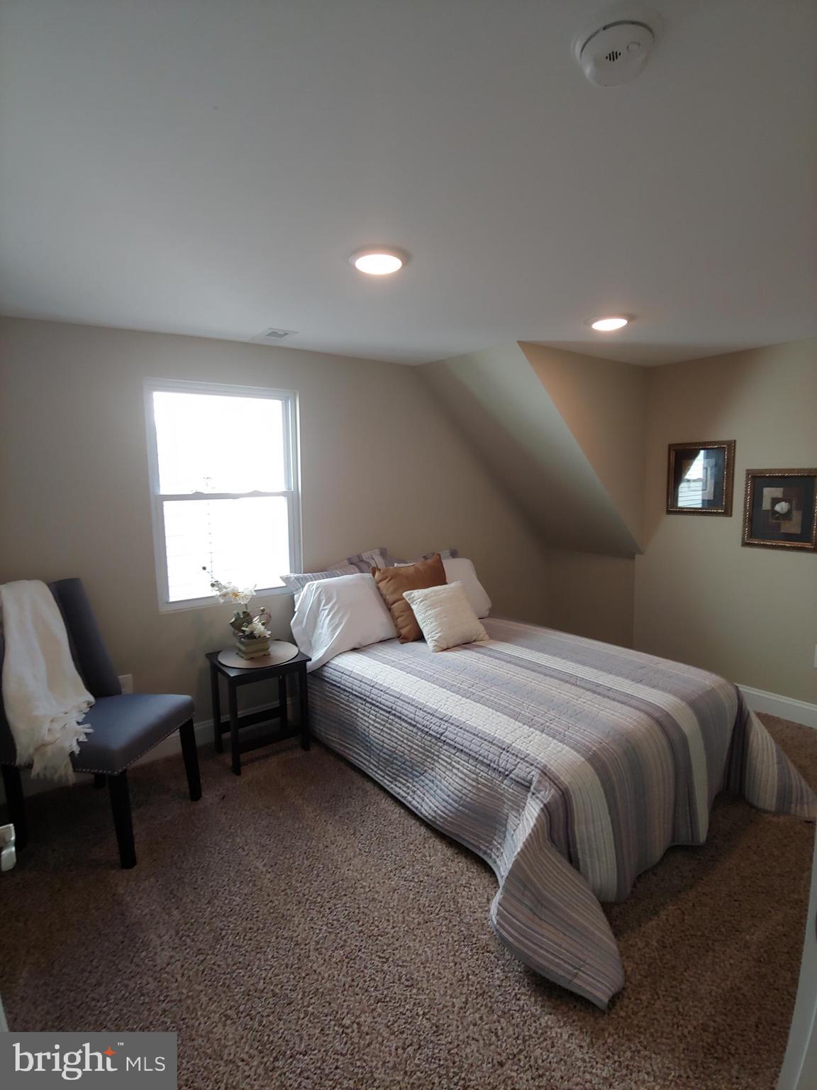150 Rancocas Road Mount Holly, NJ 08060 - Photo 18 of 25 a bedroom with a bed and a couch