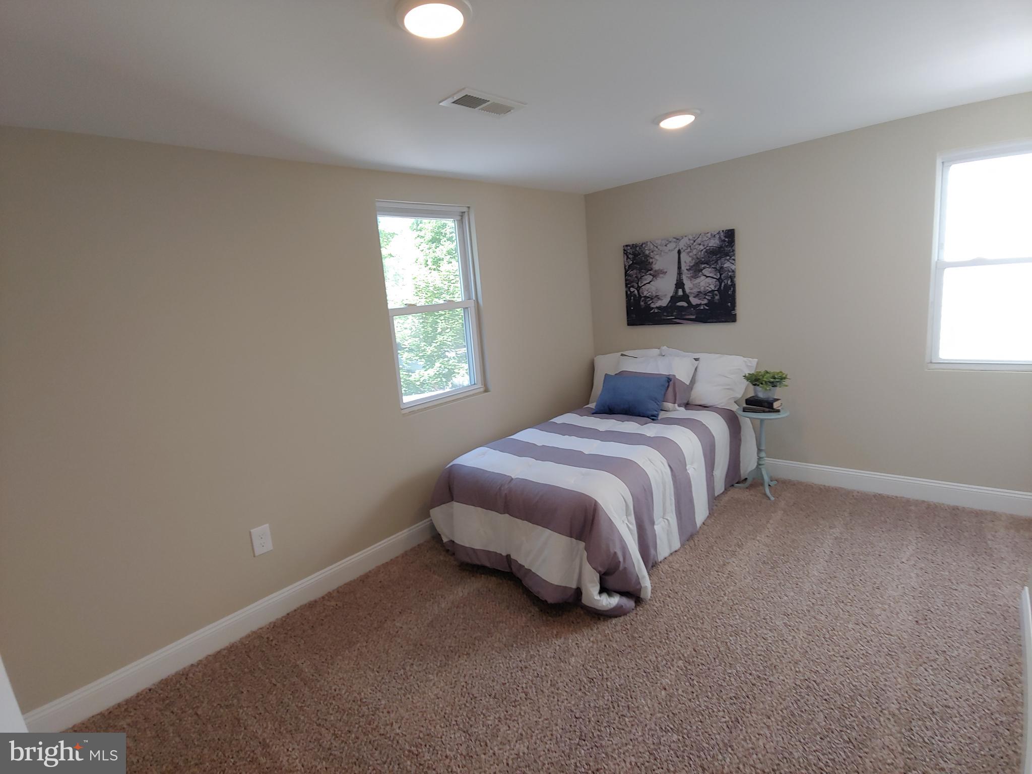 150 Rancocas Road Mount Holly, NJ 08060 - Photo 19 of 25 a spacious bedroom with a bed and a window