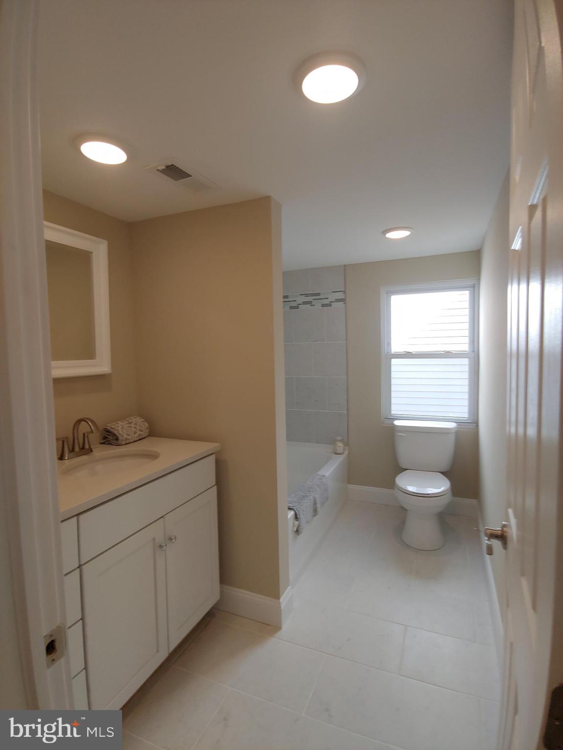 150 Rancocas Road Mount Holly, NJ 08060 - Photo 20 of 25 a bathroom with a granite countertop toilet sink and mirror