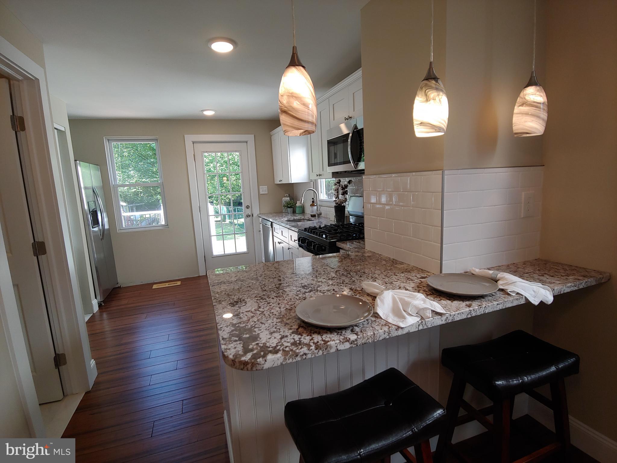 150 Rancocas Road Mount Holly, NJ 08060 - Photo 6 of 25 a kitchen with a table and chairs in it