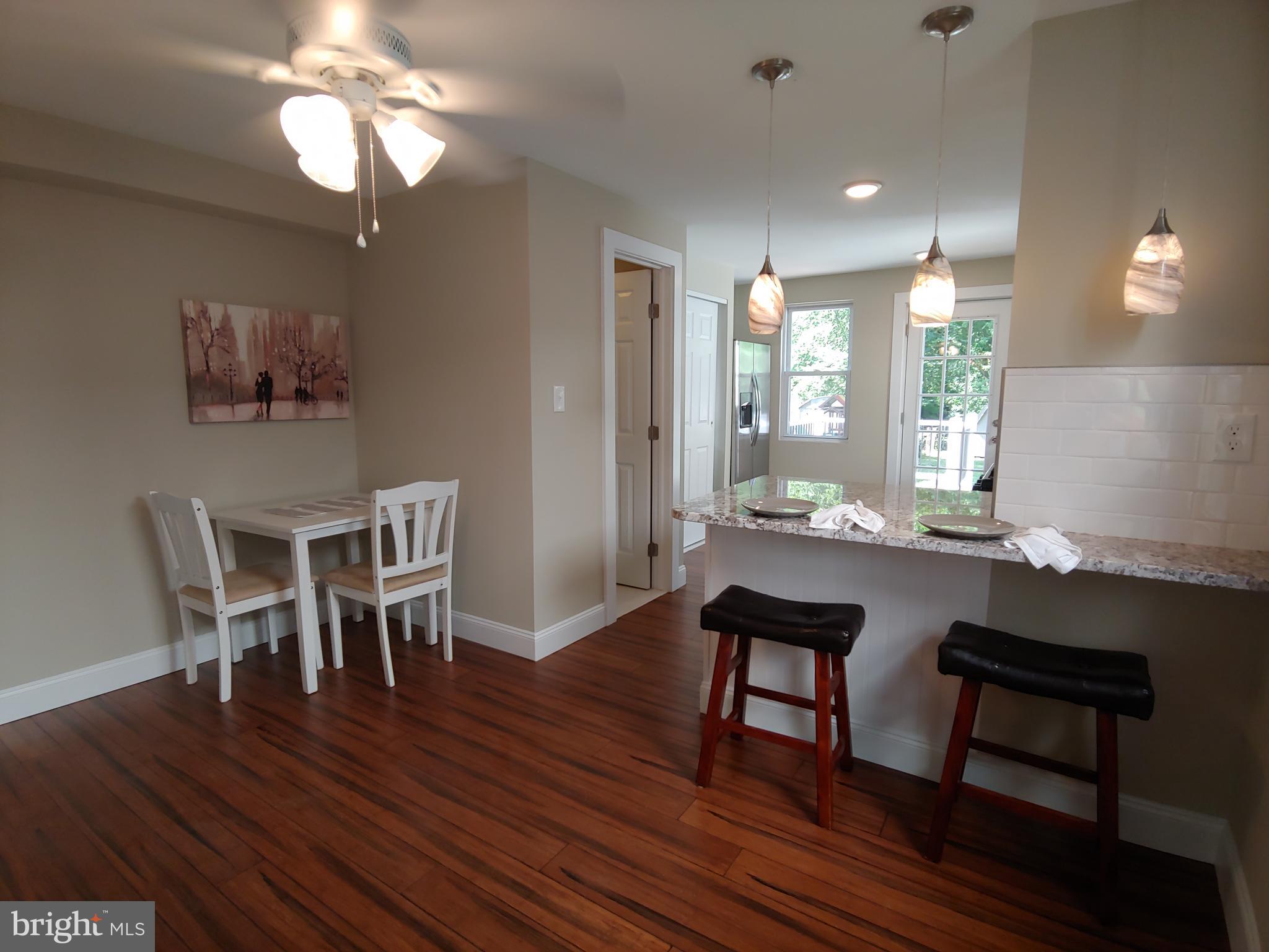 150 Rancocas Road Mount Holly, NJ 08060 - Photo 7 of 25 a room with dining table and wooden floor