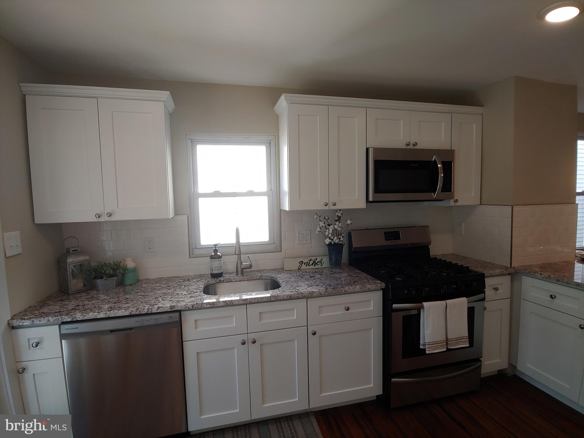 150 Rancocas Road Mount Holly, NJ 08060 - Photo 9 of 25 a kitchen with a sink stove and microwave