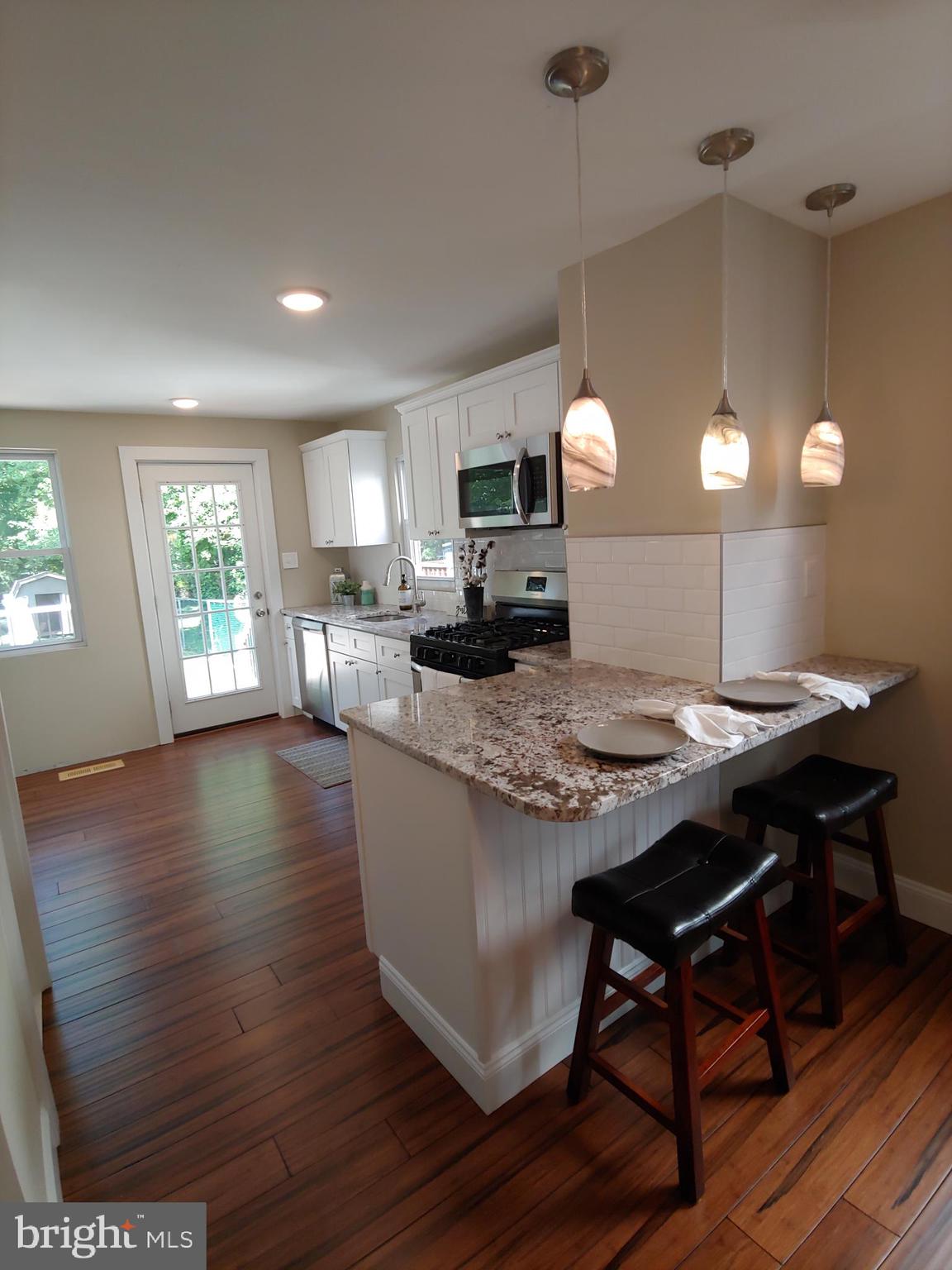 150 Rancocas Road Mount Holly, NJ 08060 - Photo 10 of 25 a kitchen with sink microwave and stove