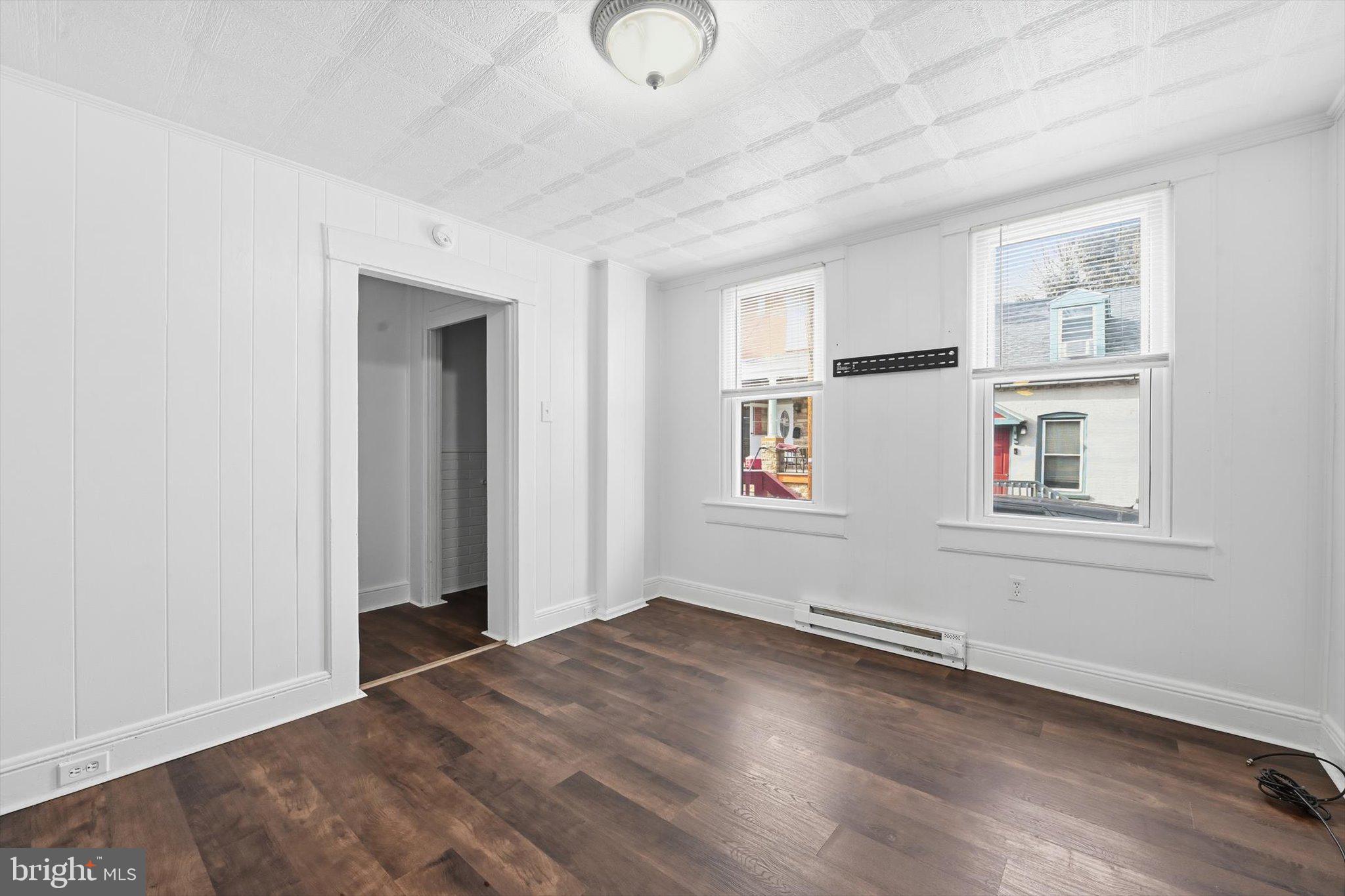 638 High Street Lancaster, PA 17603 - Photo 12 of 26 an empty room with wooden floor and windows