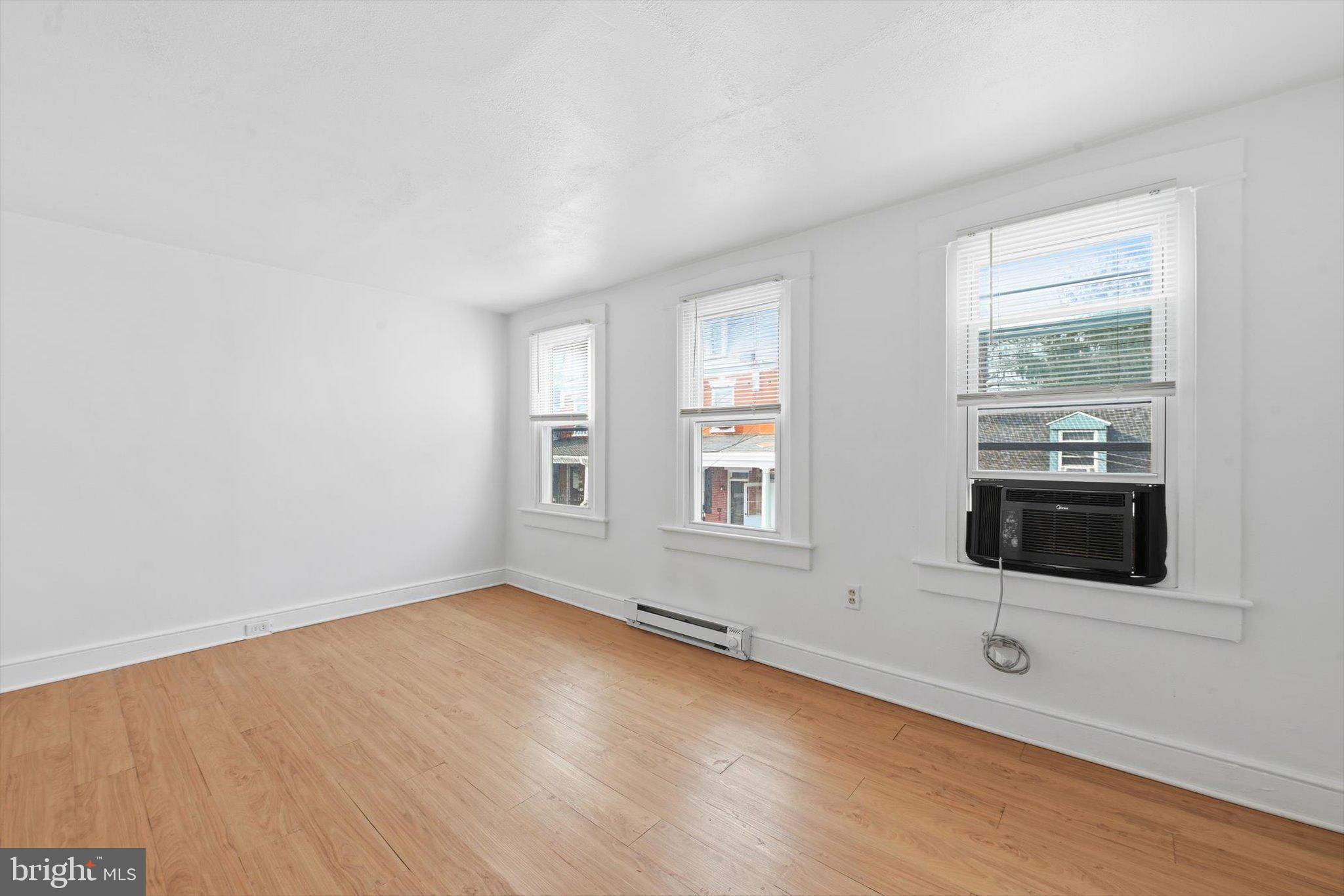 638 High Street Lancaster, PA 17603 - Photo 20 of 26 an empty room with wooden floor and windows