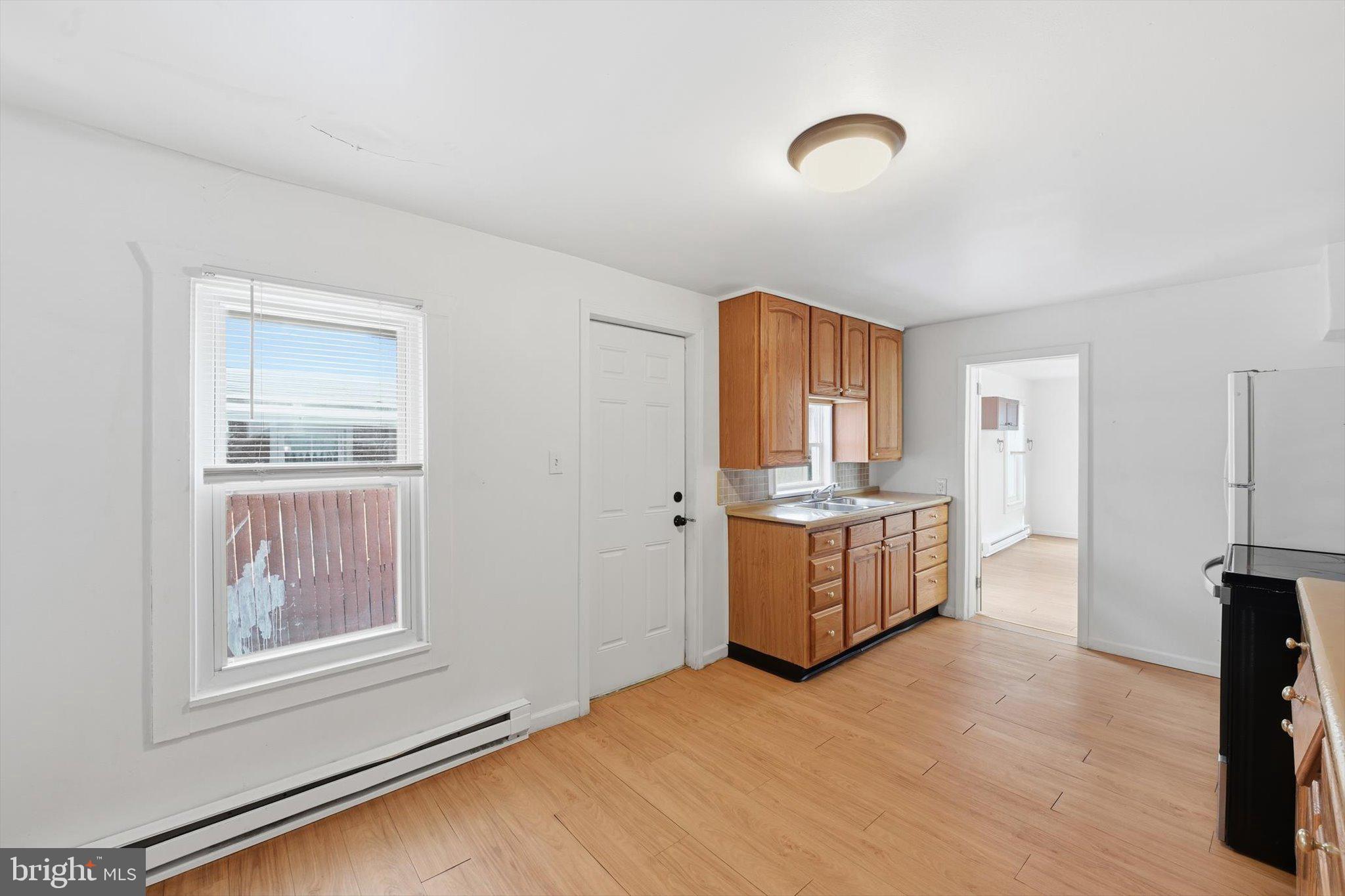 638 High Street Lancaster, PA 17603 - Photo 5 of 26 a room with a dresser and a window