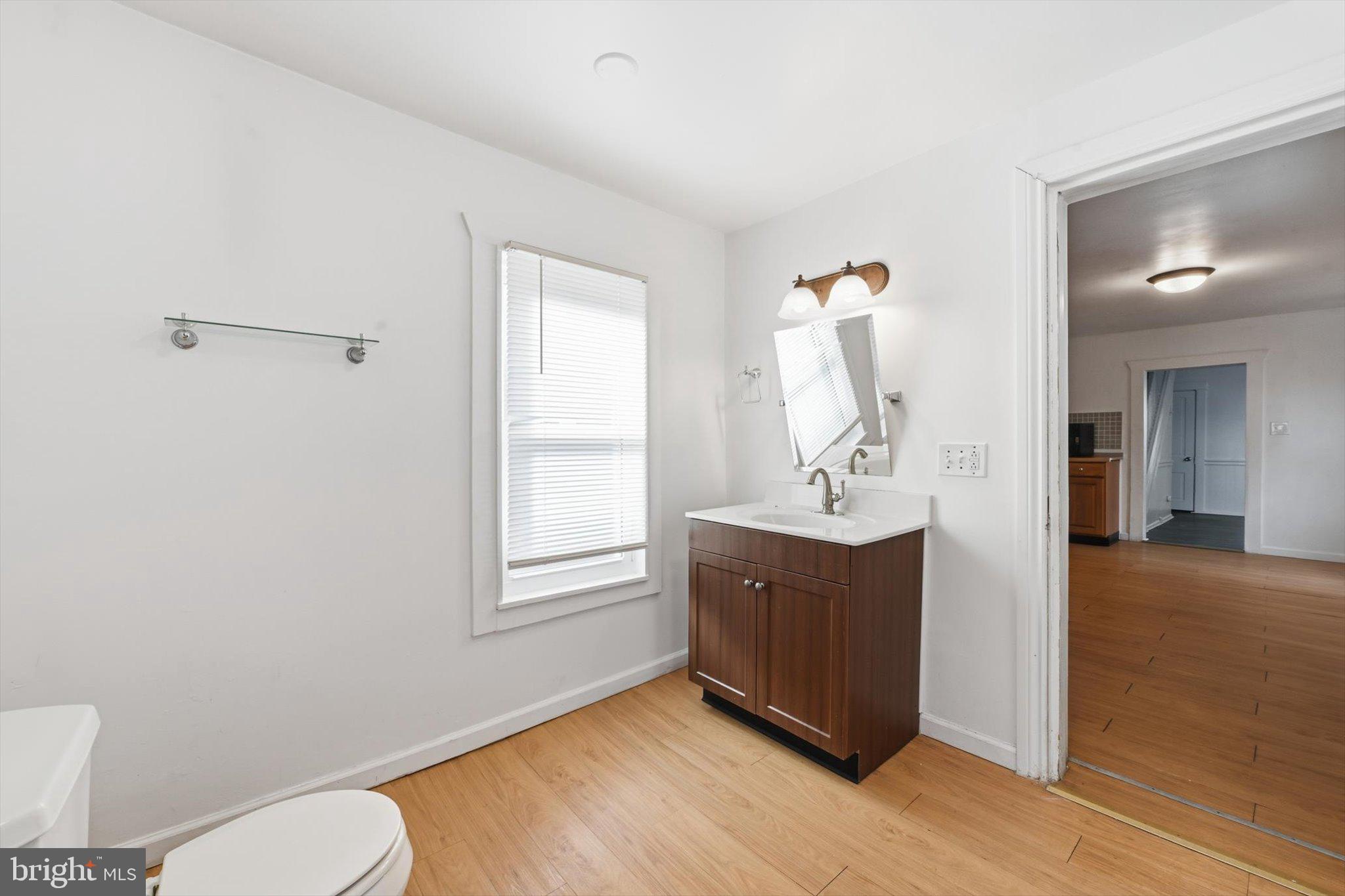 638 High Street Lancaster, PA 17603 - Photo 8 of 26 a bathroom with a sink vanity mirror and toilet