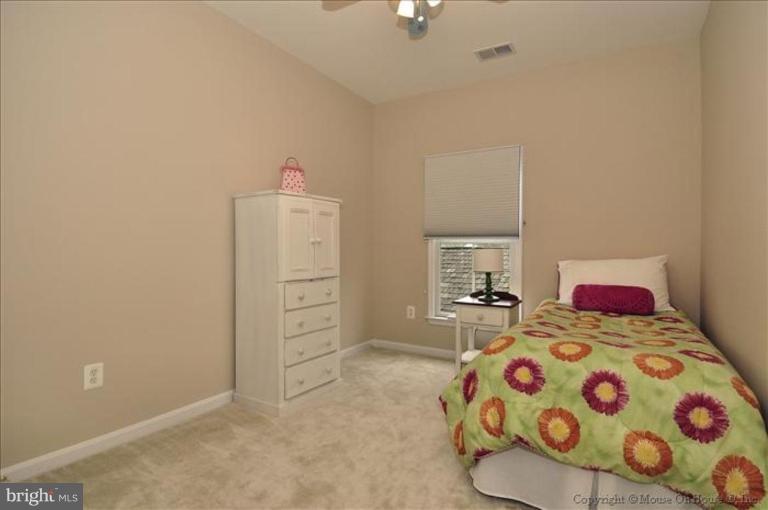 405 Main Street Gaithersburg, MD 20878 - Photo 11 of 23 a bedroom with a bed and a dresser