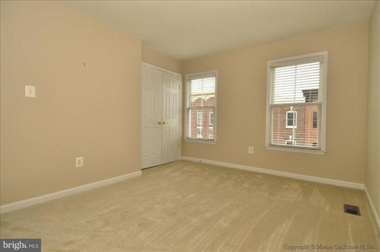 405 Main Street Gaithersburg, MD 20878 - Photo 14 of 23 a view of an empty room with windows