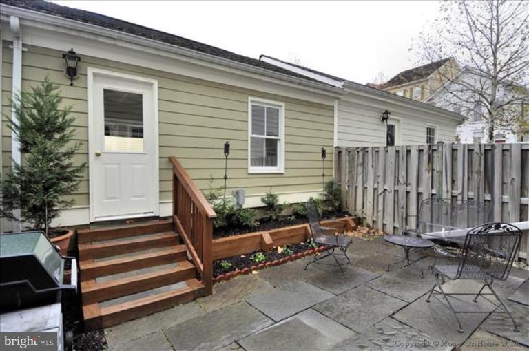 405 Main Street Gaithersburg, MD 20878 - Photo 19 of 23 a view of a house with backyard and wooden fence