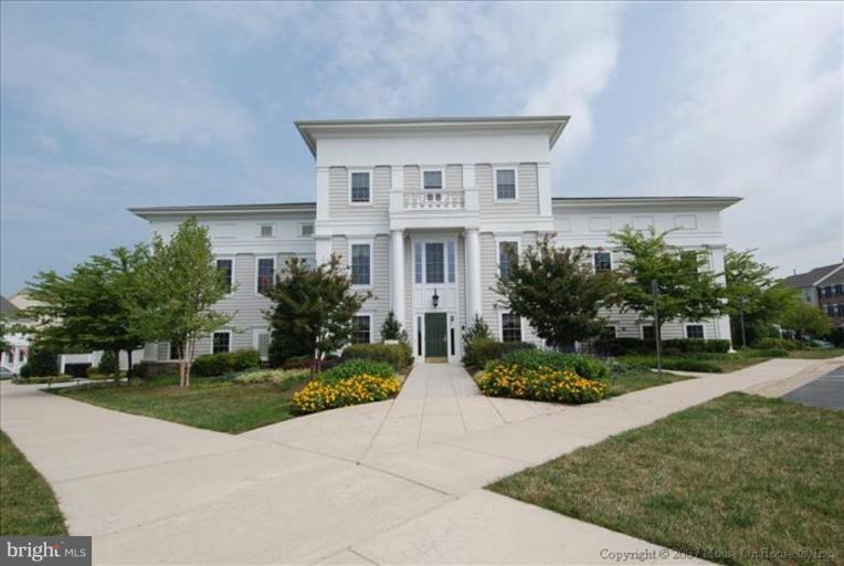 405 Main Street Gaithersburg, MD 20878 - Photo 20 of 23 a front view of house with yard and green space