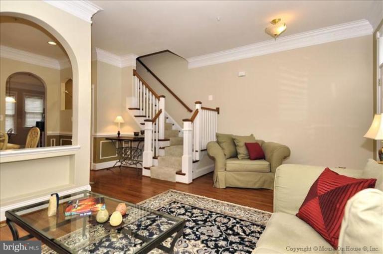 405 Main Street Gaithersburg, MD 20878 - Photo 4 of 23 a living room with furniture and wooden floor