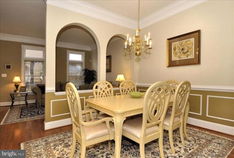 405 Main Street Gaithersburg, MD 20878 - Photo 5 of 23 a view of a dining room with furniture and wooden floor