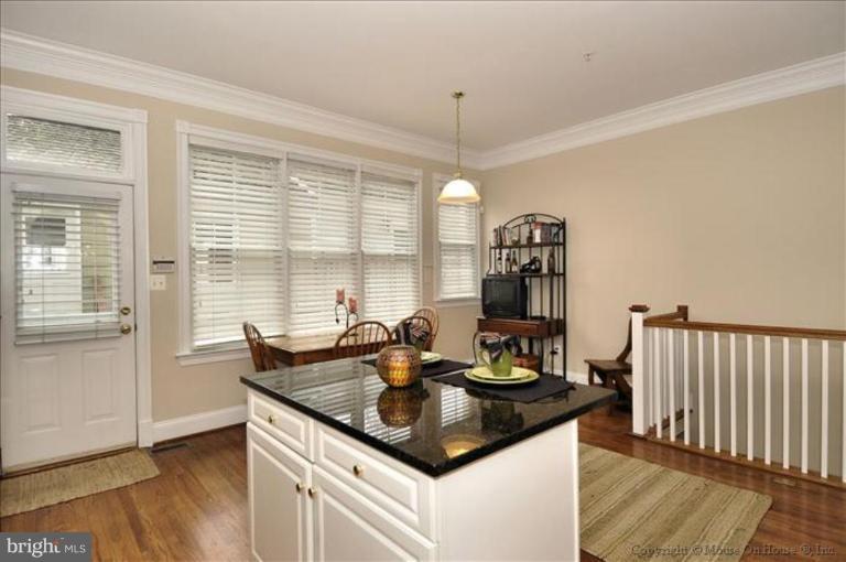 405 Main Street Gaithersburg, MD 20878 - Photo 7 of 23 a kitchen with granite countertop a sink and a stove