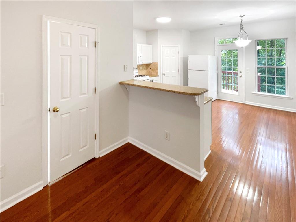 2225 Dillard Crossing Tucker, GA 30084 - Photo 20 of 41 an empty room with wooden floor and windows