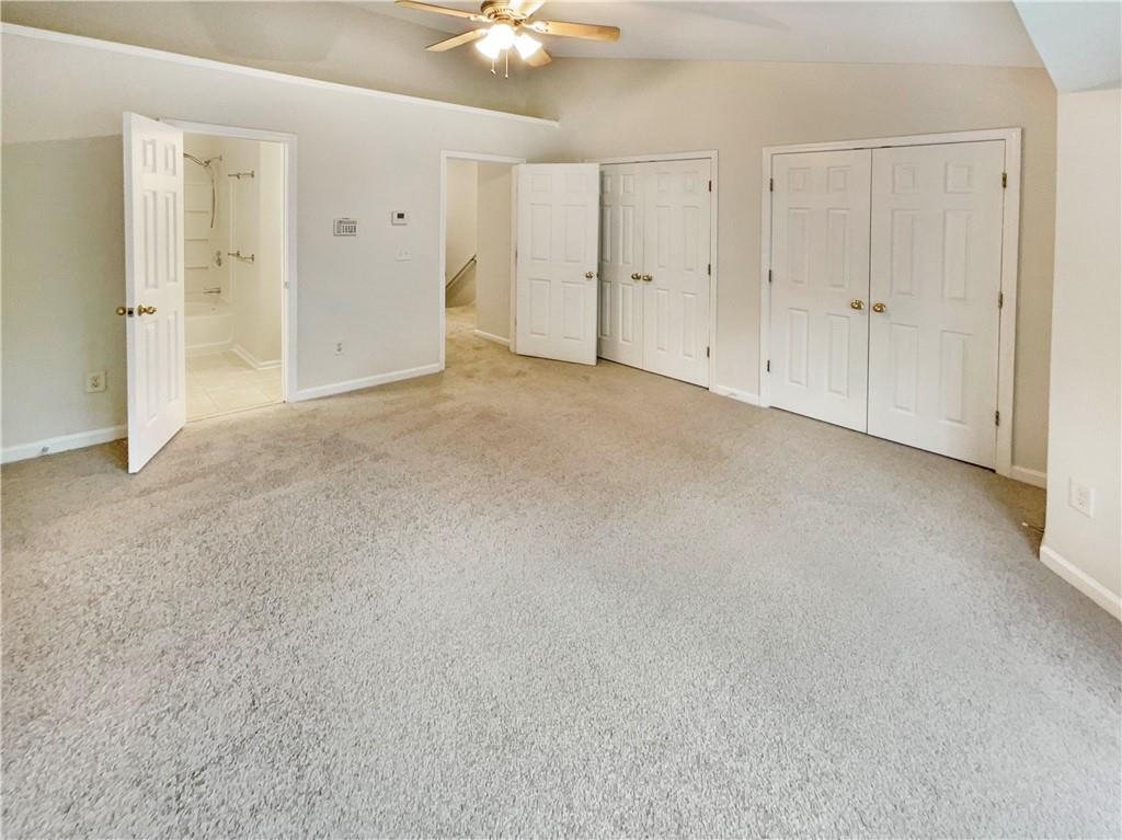 2225 Dillard Crossing Tucker, GA 30084 - Photo 25 of 41 an empty room with a ceiling fan