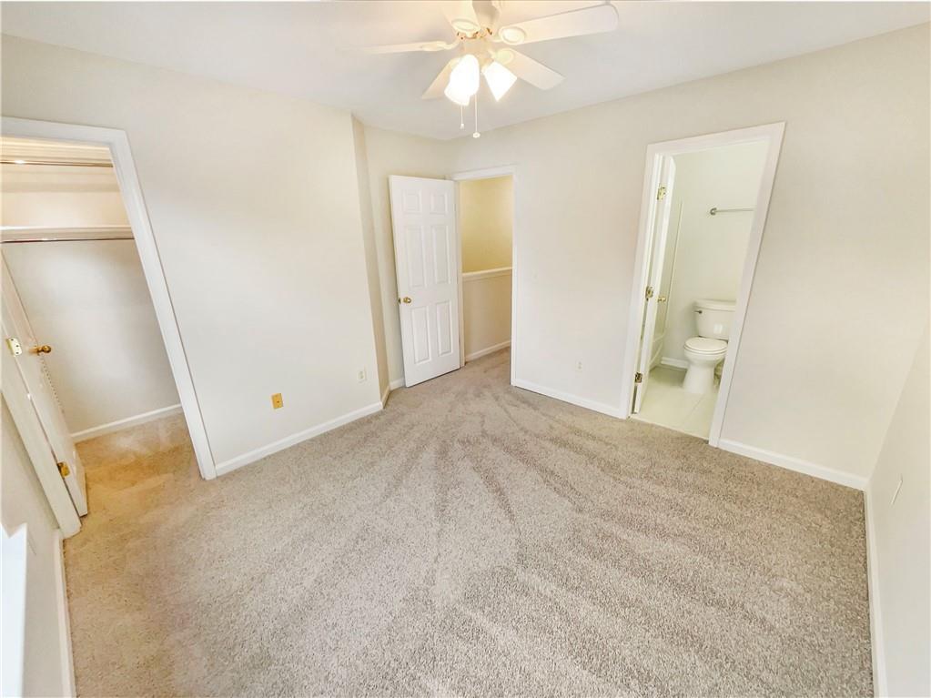 2225 Dillard Crossing Tucker, GA 30084 - Photo 26 of 41 a view of an empty room with wooden floor and a window