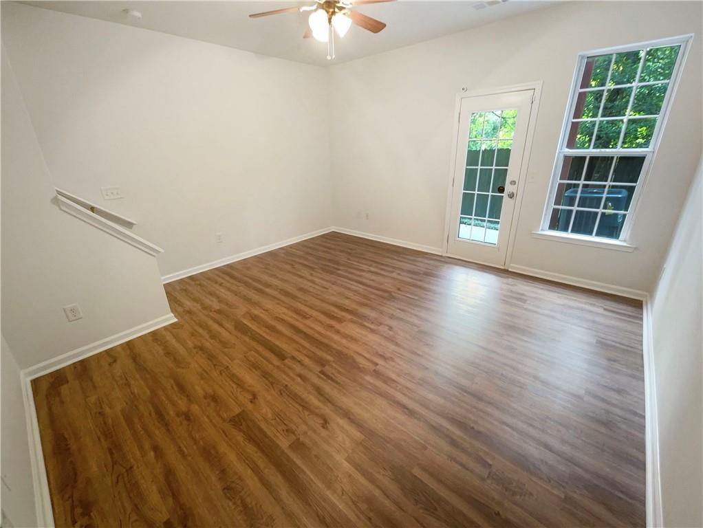 2225 Dillard Crossing Tucker, GA 30084 - Photo 38 of 41 wooden floor in an empty room with a window