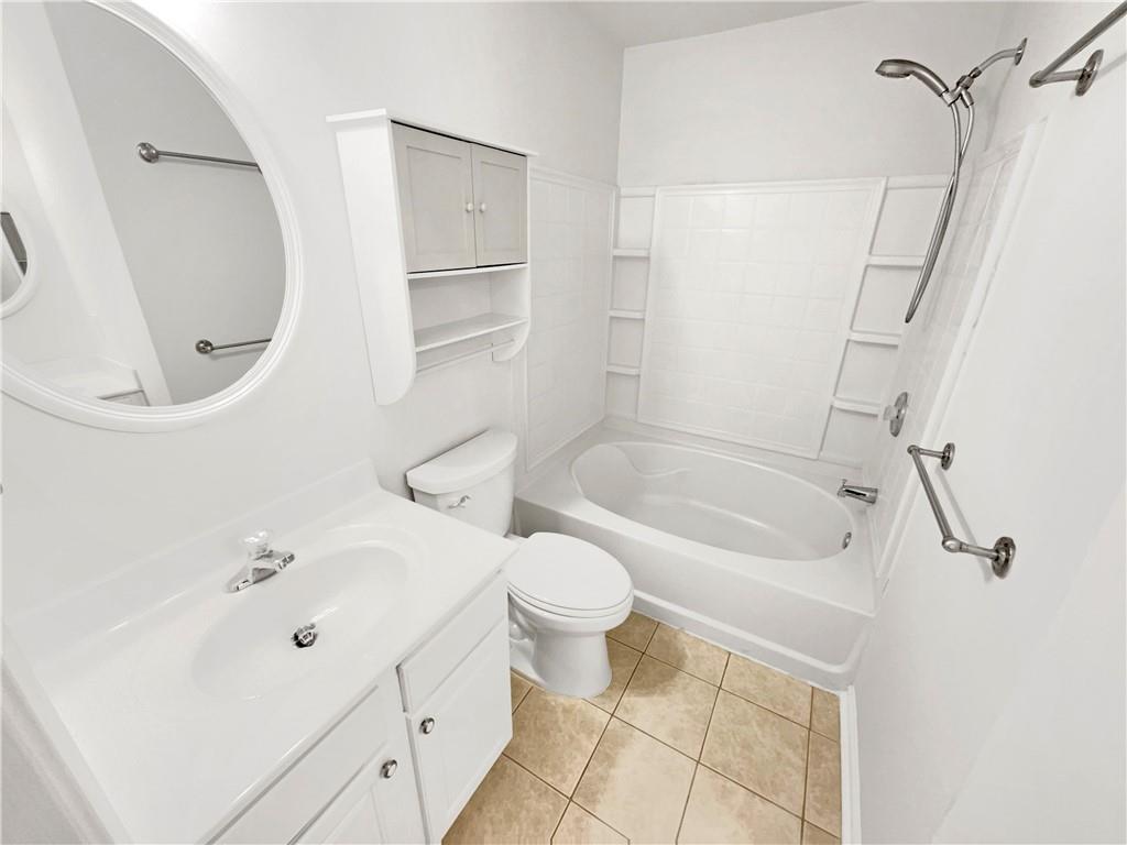 2225 Dillard Crossing Tucker, GA 30084 - Photo 8 of 41 a bathroom with a sink a toilet and shower