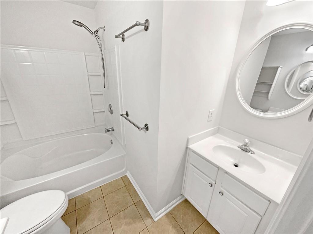 2225 Dillard Crossing Tucker, GA 30084 - Photo 9 of 41 a bathroom with a sink a toilet and a bathtub