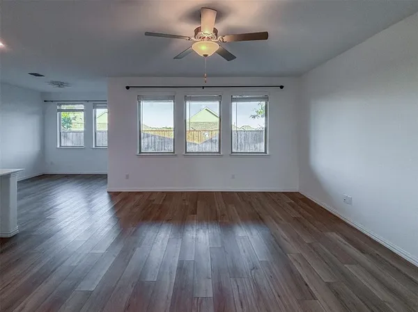 a view of kitchen with sink and wooden floor