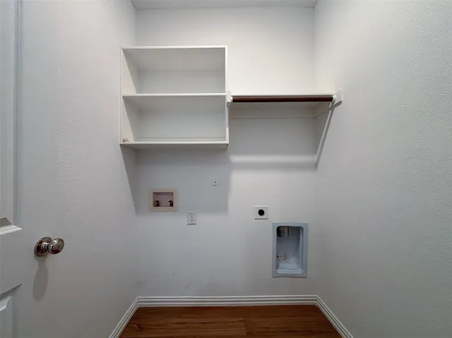 a view of storage and utility room with racks on the wall