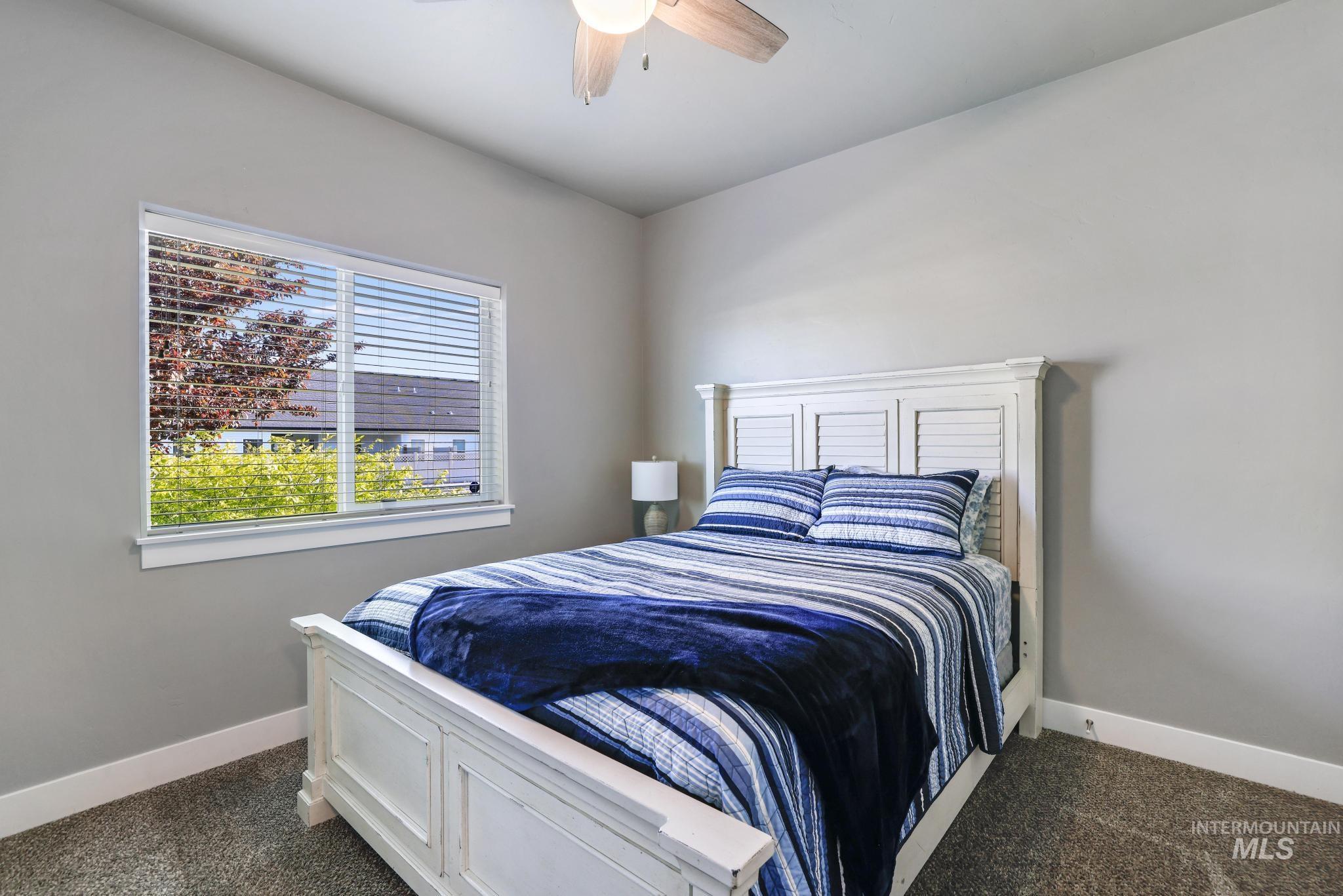 1050 Birchton Loop Twin Falls, ID 83301 - Photo 15 of 45 Carpeted bedroom with neutral wall tones and a single window offering natural illumination