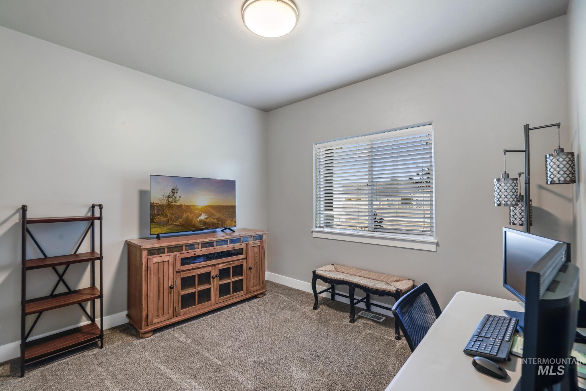 1050 Birchton Loop Twin Falls, ID 83301 - Photo 17 of 45 Carpeted room with a single window featuring horizontal blinds
