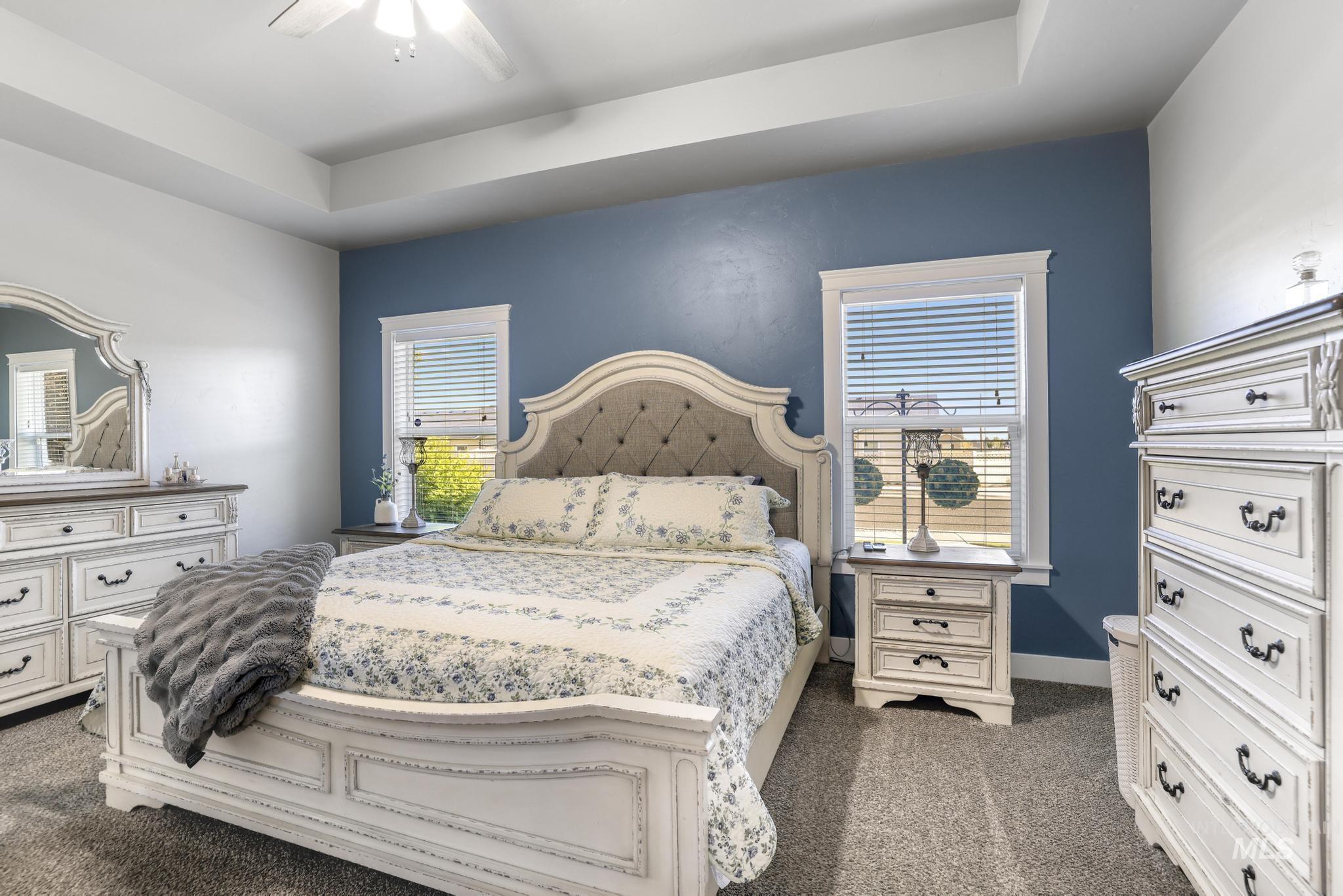 1050 Birchton Loop Twin Falls, ID 83301 - Photo 20 of 45 Carpeted room featuring a ceiling fan, recessed ceiling, and multiple windows with white blinds