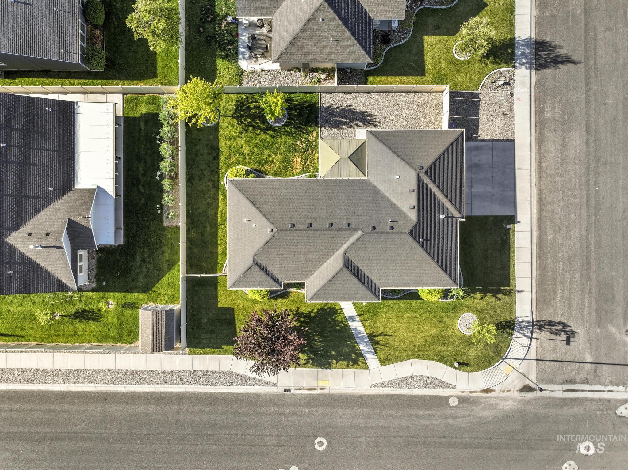 1050 Birchton Loop Twin Falls, ID 83301 - Photo 37 of 45 Aerial view showcasing a residential property with a dark shingle roof and an attached garage