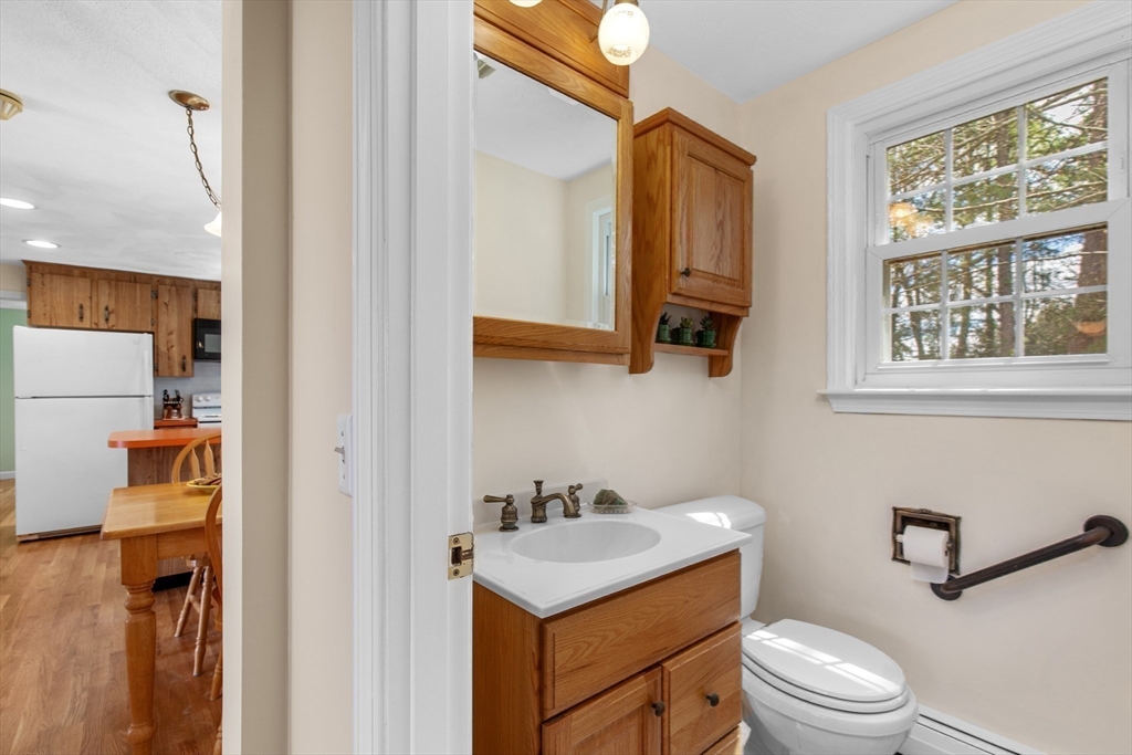 15 Massasoit Circle Walpole, MA 02032 - Photo 12 of 34 a bathroom with a toilet sink and mirror
