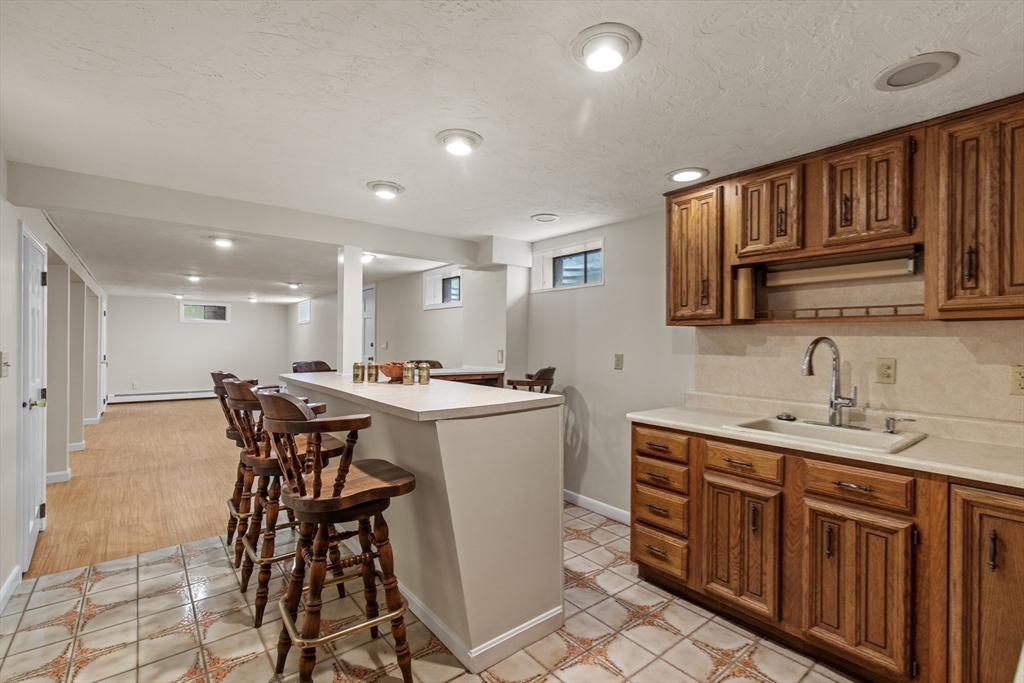 15 Massasoit Circle Walpole, MA 02032 - Photo 21 of 34 a kitchen with a sink a counter space and appliances