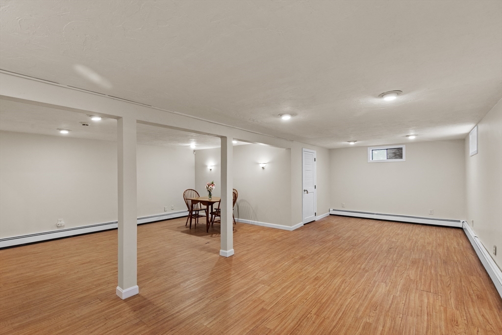 15 Massasoit Circle Walpole, MA 02032 - Photo 23 of 34 a view of empty room with wooden floor