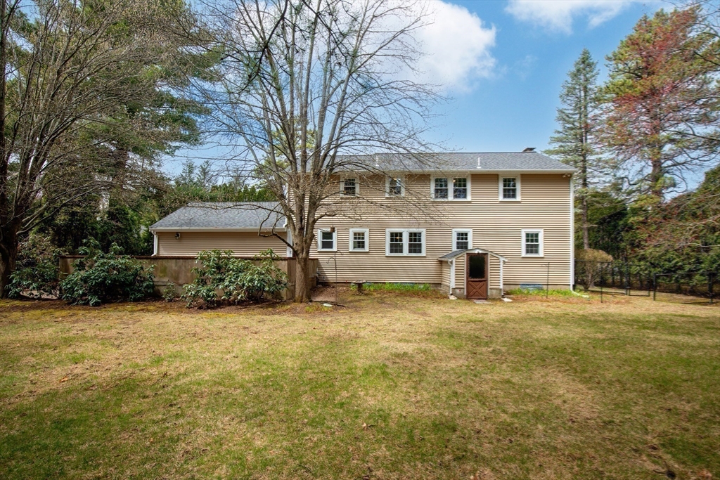 15 Massasoit Circle Walpole, MA 02032 - Photo 25 of 34 a front view of a house with yard and trees