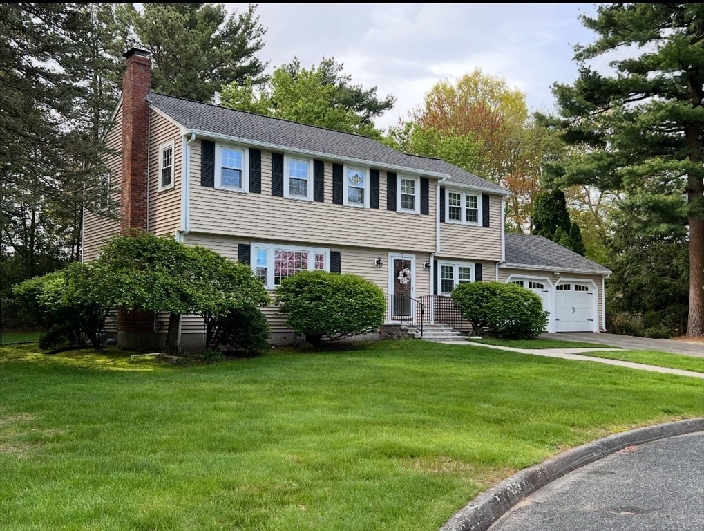 15 Massasoit Circle Walpole, MA 02032 - Photo 28 of 34 a front view of a house with a yard and trees